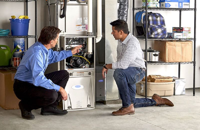 Homeowner and Central employee discussing a furnace