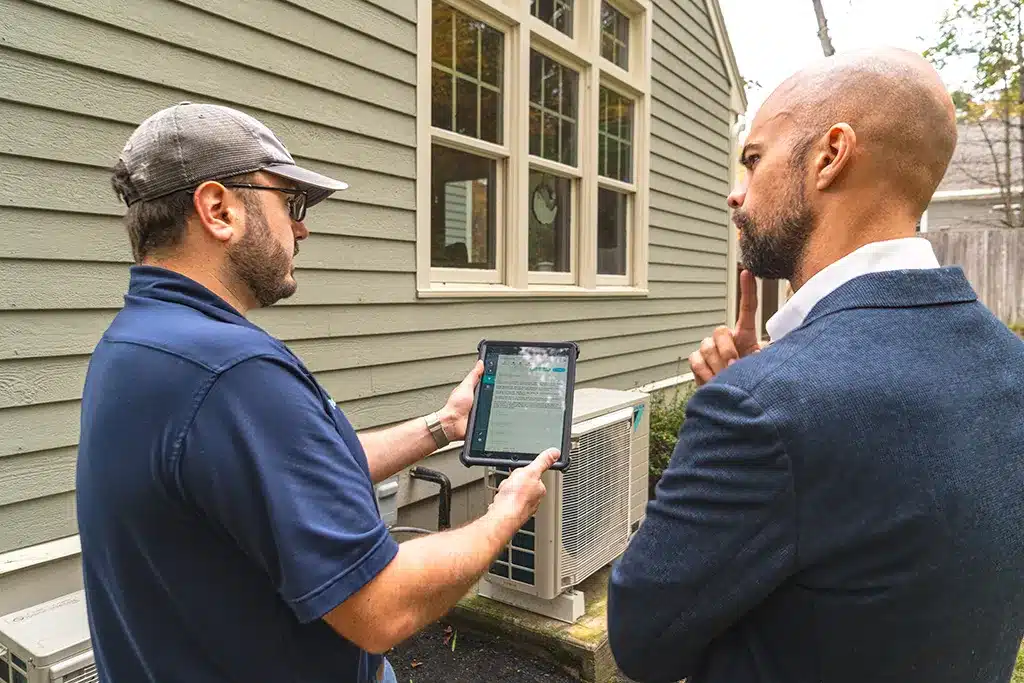 A Central employee demonstrating something to a customer