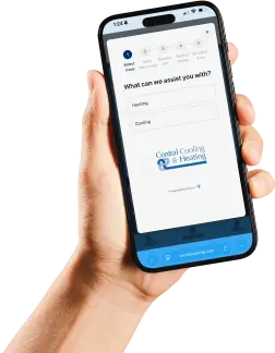 A hand holds a smartphone displaying a service request form for Central Cooling & Heating on its screen.