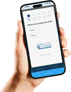 A hand holding a smartphone displaying a service request form for Central Cooling & Heating.